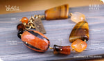 Load image into Gallery viewer, bhavaa Premium Gemstone Jewelry- Bracelet. Rustic Elegance Collection, Mark-1 | Gemstones: Orange Carnelian Faceted, Orange Crab Agate Faceted, Orange Jade, Brown Tigereye, Brown Agate
