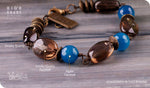 Load image into Gallery viewer, bhavaa Premium Gemstone Jewelry- Bracelet. Serene Indulgence Collection, Mark-2 | Gemstones: Blue Agate Faceted, Smoky Quartz Faceted, Smoky Quartz Smooth
